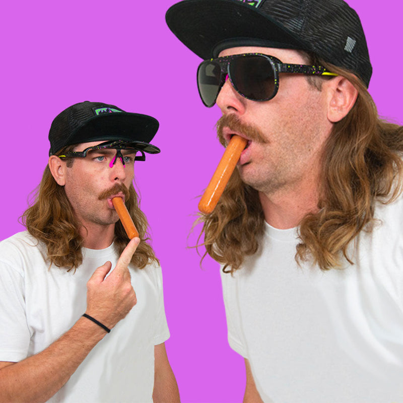 / Smoke | Yellowlight.JPG | Man with a hotdog in his mouth wearing Pit Viper Sunglasses