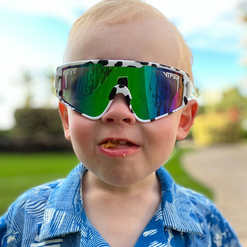 / Blue-Green | poopoo.JPG | Baby on a stationary bike in The Cowabunga Baby Vipes from Pit Viper Sunglasses