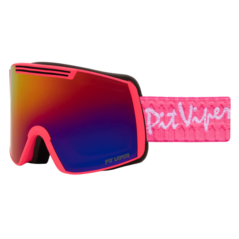 | side_view.JPG | Pit Viper snow goggles with a vibrant pink frame, a gradient red-to-blue mirrored lens, and a textured pink strap featuring the white Pit Viper logo.