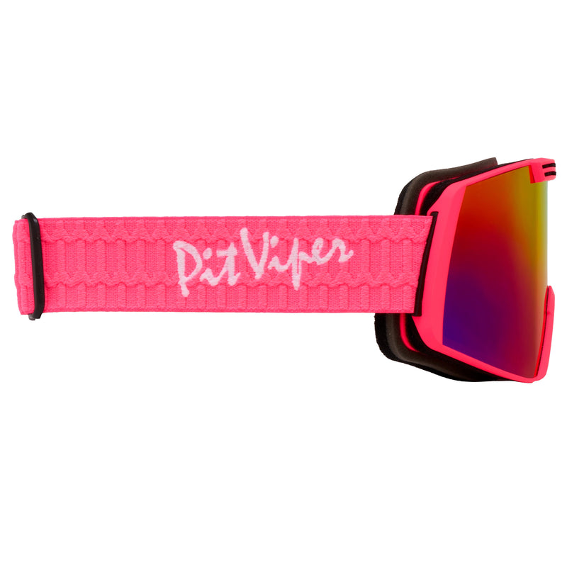 | even_more_side_view.JPG | Goggles with a bright pink textured strap featuring the white 'Pit Viper' logo, a black frame, and a reflective red-to-yellow mirrored lens.