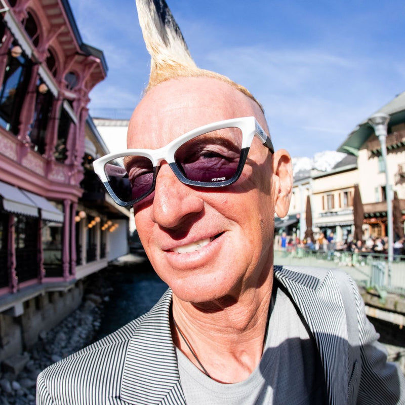  | photo_of_person.JPG | Man looks at camera wearing the mohawker clawdia