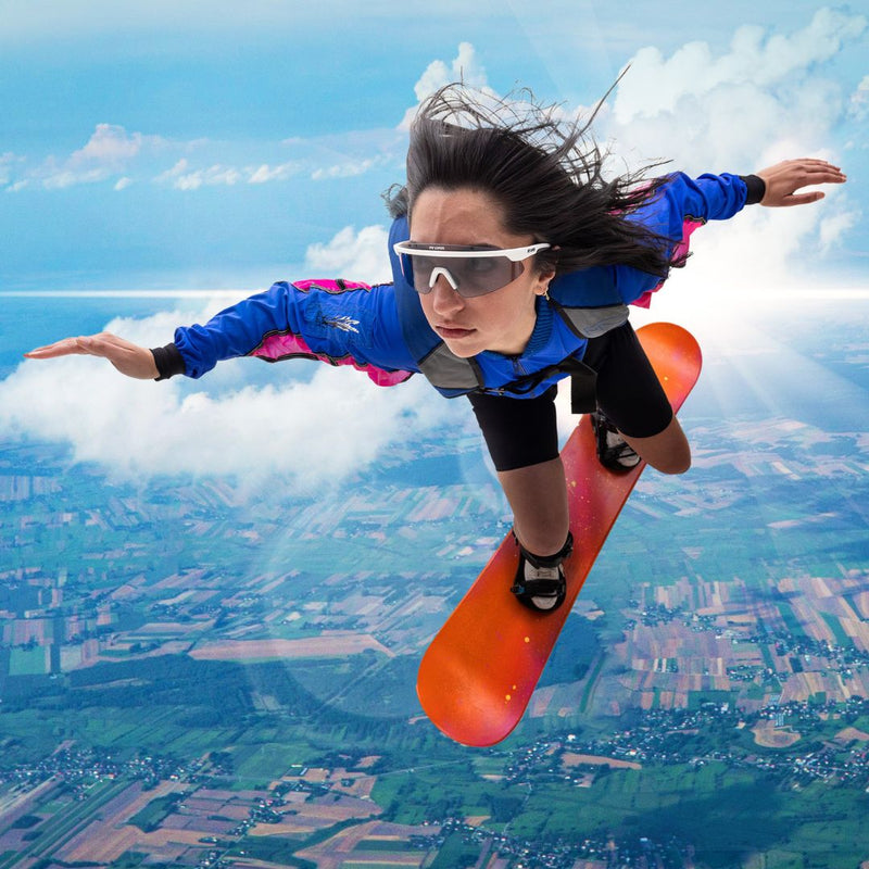 / Photochromic Smoke | photo_of_person.JPG | Woman pretends to fly wearing The Miami Nights Skysurfer with a Photochromic Smoke lens from Pit Viper Sunglasses