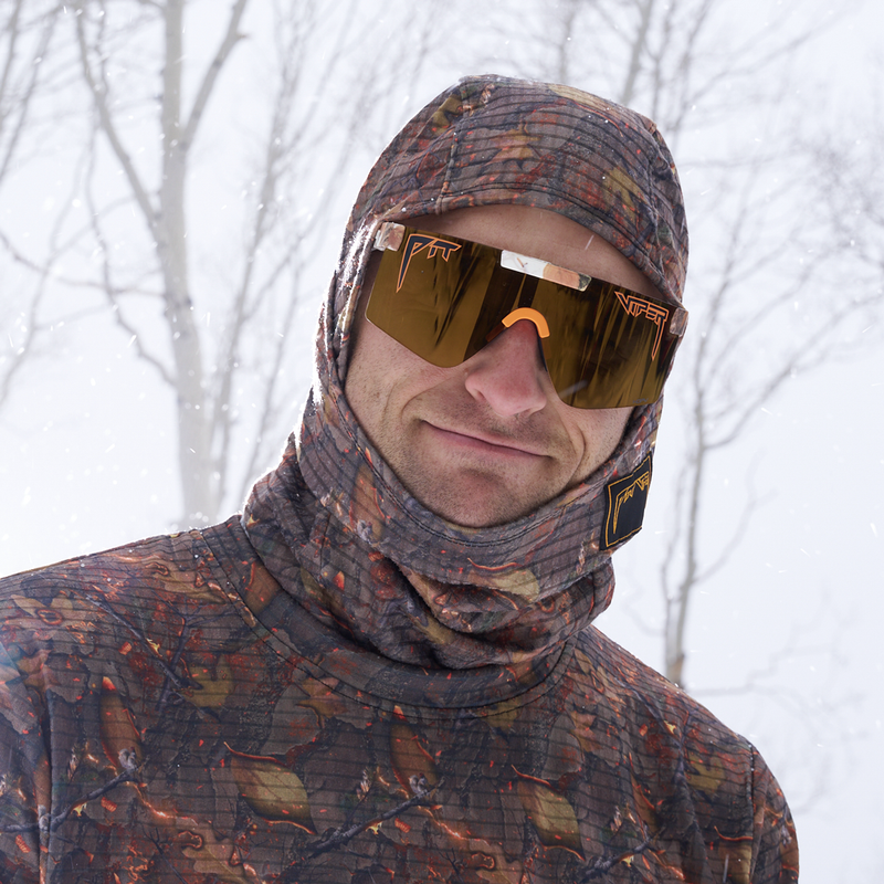 | photo_of_nick_g.JPG | A man wearing a camouflage winter balaclava hood and neck gaiter with matching camouflage ski goggles, photographed outdoors in the snow.