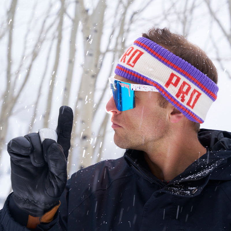| photo_of_nick_g.JPG | Nick Goepper holding a finger up while wearing the Pro Half Hat Headband from Pit Viper in the snowy forest.