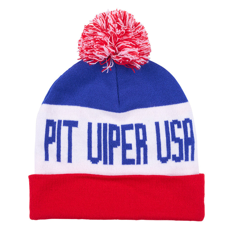 | full_frontal.JPG | A knit beanie hat with a red and white pom-pom on top, featuring horizontal blue, white, and red stripes with the text 'PIT VIPER USA' in blue on the white band, and a solid red cuff at the bottom.