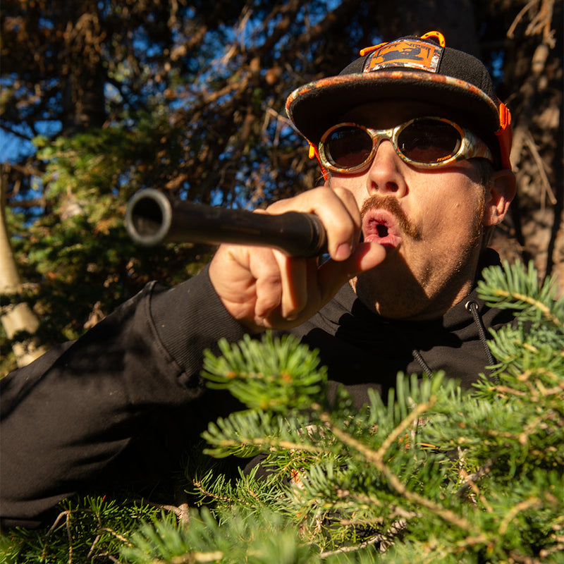 | photo_of_person.JPG | The Actualbush Slammer by Pit Viper, 1999 retro oval sunglasses with deerstalker camouflage on the frame