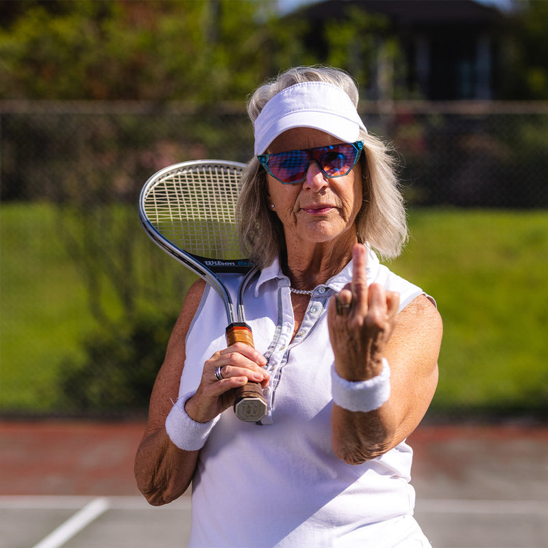  | photo_of_person.JPG | Tennis player flipping off the camera wearing The Aquamarine Showroom from Pit Viper Sunglasses