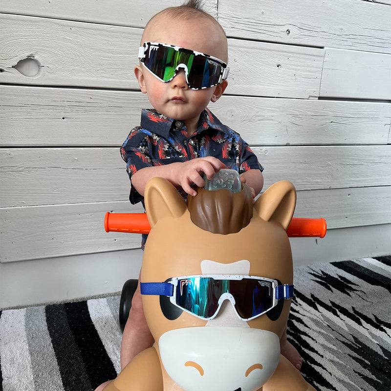 / Blue-Green | beep.JPG | Baby on a toy horse in The Cowabunga Baby Vipes from Pit Viper Sunglasses