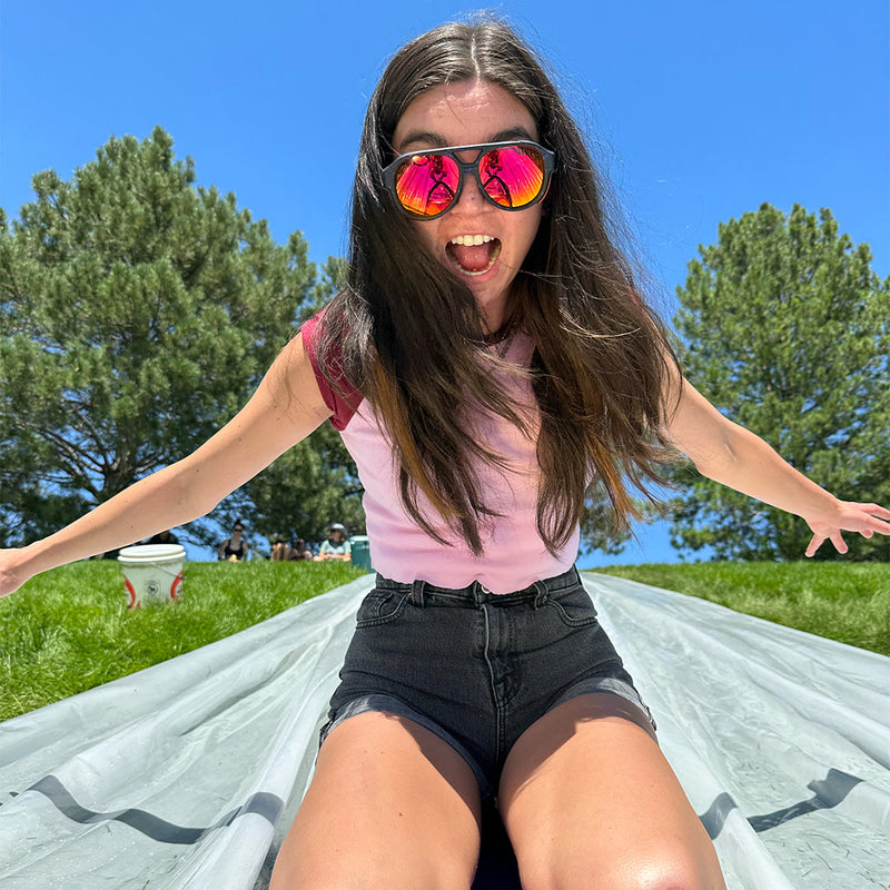 | just_kidding.JPG | Woman on a slip and slide wearing Pit Viper Sunglasses