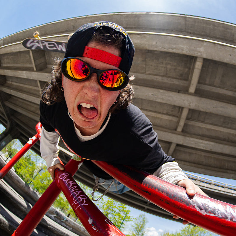 / Red | thats_why_i_took_all_these_photos.JPG | Woman falling off of a skateboard wearing Pit Viper Sunglasses