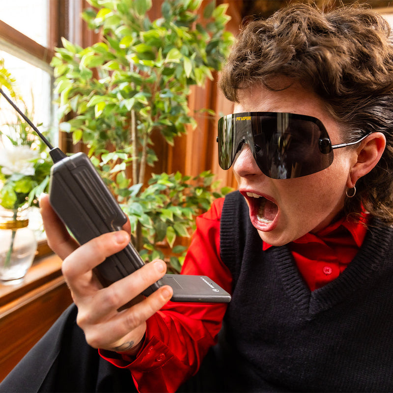 / Polarized Smoke | photo_of_person.JPG | Woman screaming at a phone wearing The Exec Limousine from Pit Viper Sunglasses