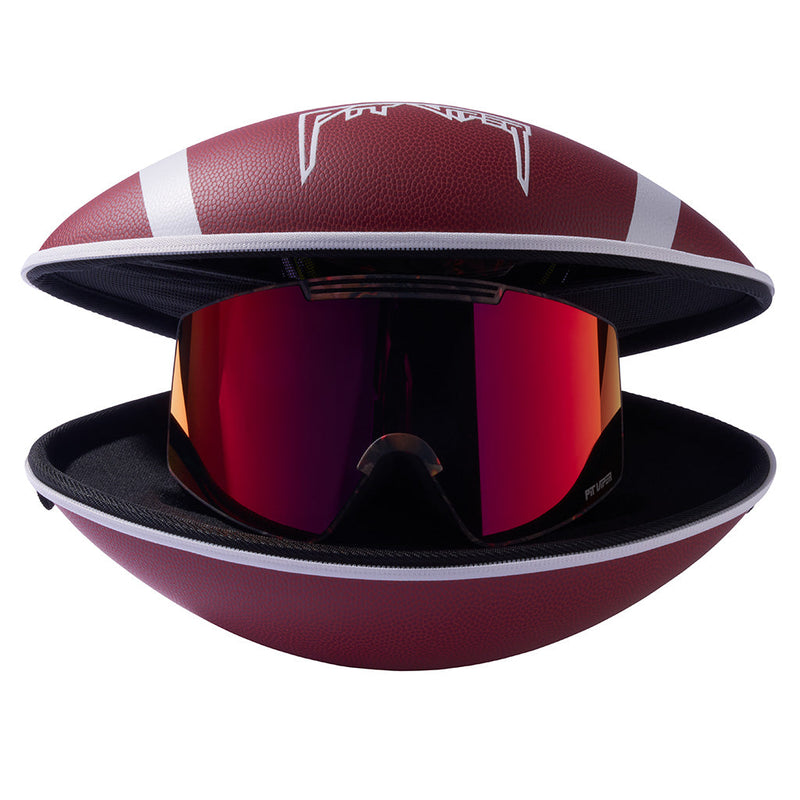 | goggles_inside_a_football.JPG | A football shaped goggle case with goggles inside open against a white background.