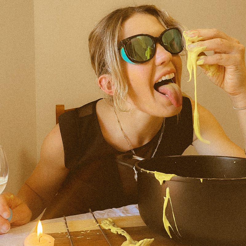 / Blue | photo_of_person_2.JPG | Woman eating fondue wearing Pit Viper Sunglasses