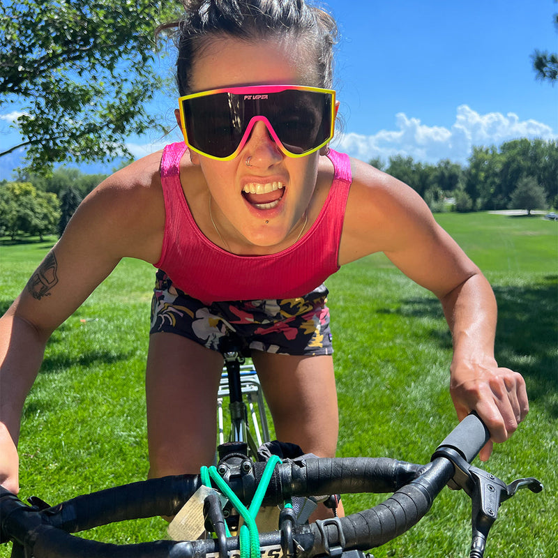  | photo_of_person.JPG | Woman on a bike wearing the Italo Try-Hard from Pit Viper Sunglasses