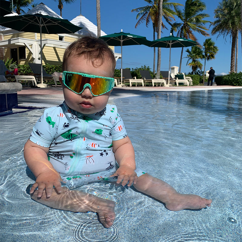 / Rainbow | blahblahblah.JPG | Baby in a pool wearing The Poseidon Baby Vipes from Pit Viper Sunglasses