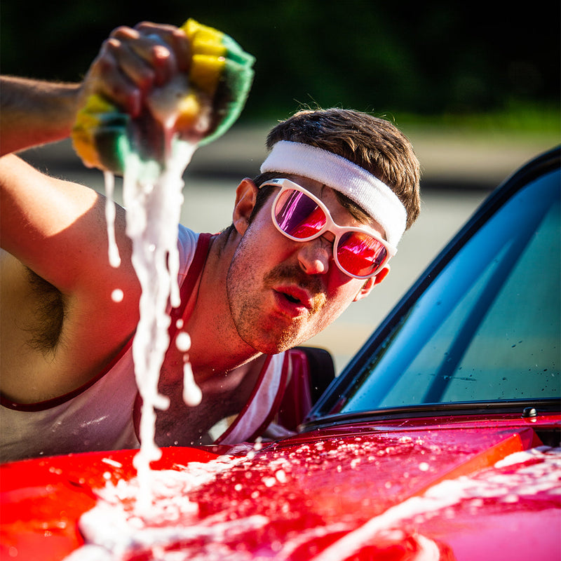 / Pink | photo_of_person.JPG | Man washing a car wearing Pit Viper Sunglasses