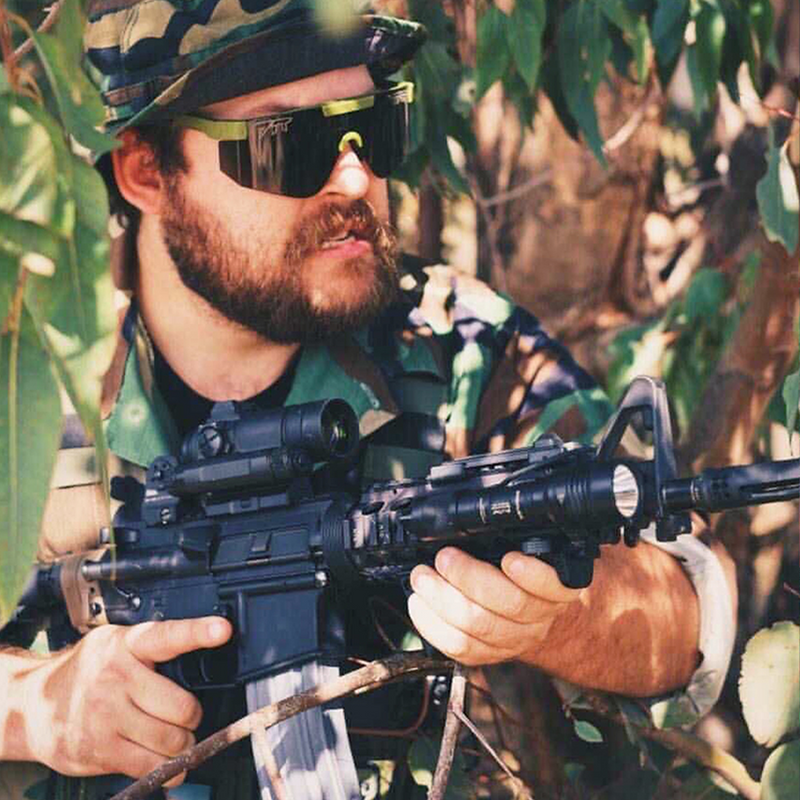 / BALL-ISTIC™ Smoke | super_important_file.JP | Man holding a gun wearing Pit Viper Sunglasses