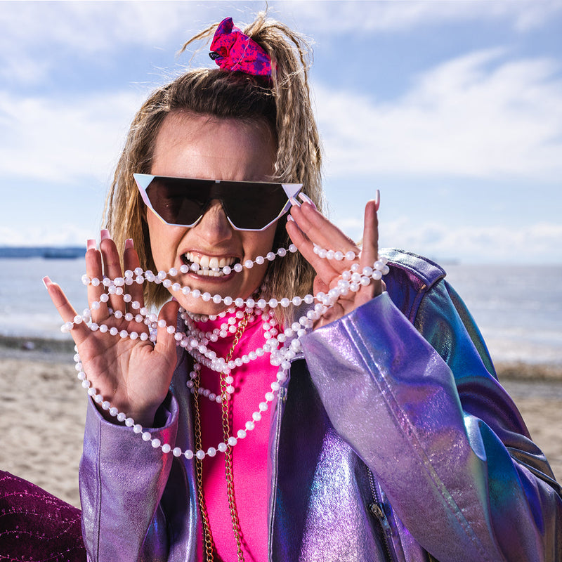 / Smoke | photo_of_person.JPG | Woman biting pearls wearing The Pearl Showroom from Pit Viper Sunglasses