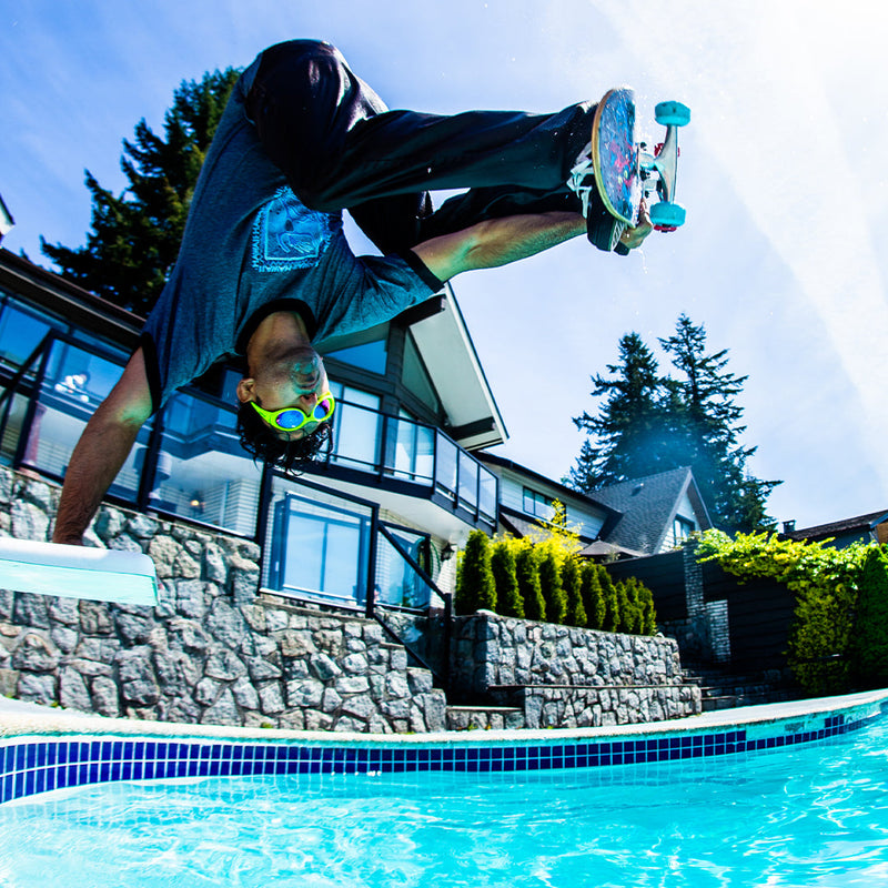 / Blue-Purple | hurts.JPG | Man riding a skateboard into a pool wearing Pit Viper Sunglasses