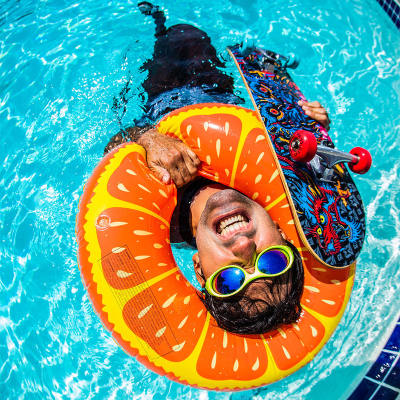 / Blue-Purple | and.JPG | Man holding a skateboard in a swimming pool wearing Pit Viper Sunglasses