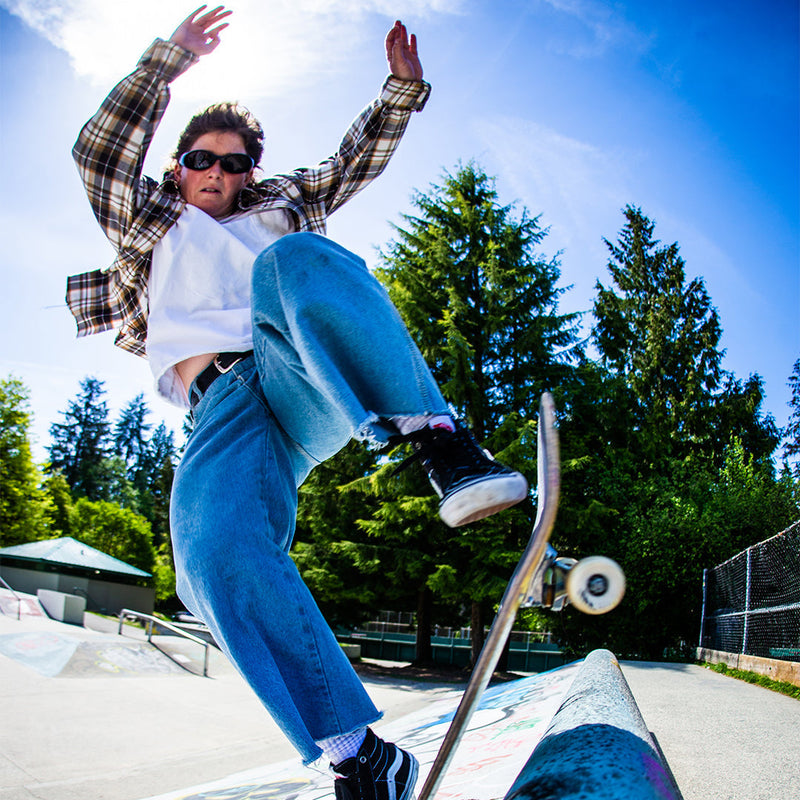 / Smoke | photo_of_person_2.JPG | Woman skateboarding wearing Pit Viper Sunglasses