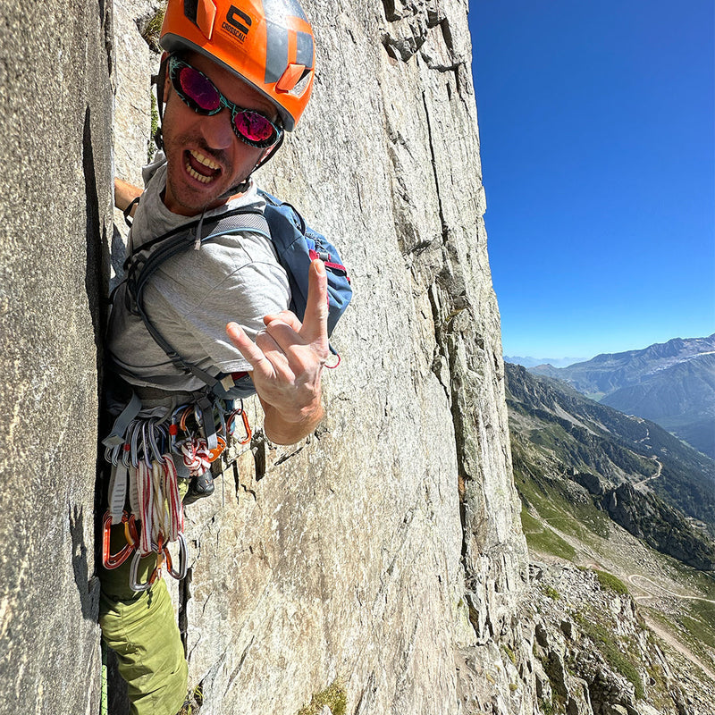  | photo_of_person_2.JPG | Man rock climbing in The Voltage Slammer from Pit Viper Sunglasses